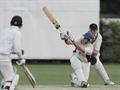 Calvin hits a six onto the pavilion roof.jpg